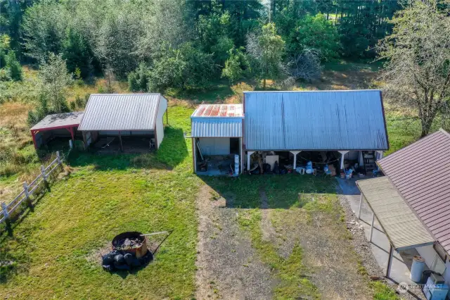 Additional detached structures and carport with artist's loft.  Fire Pit! Covered patio off of pack of home.