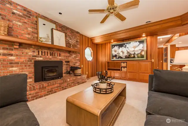 Wood burning fireplace and brick hearth in family room