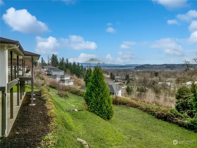 Tiered slope in rear makes for low maintenance back yard and great views.