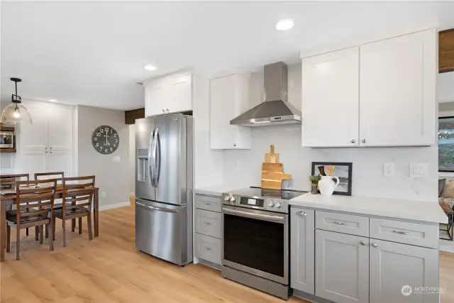 Completely remodeled kitchen with high end appliances, waterfall granite counters, custom cabinets and gorgeous fixtures.