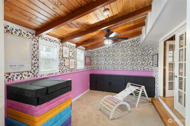 Sitting room outside the primary bedroom. Beautiful wood vaulted ceiling