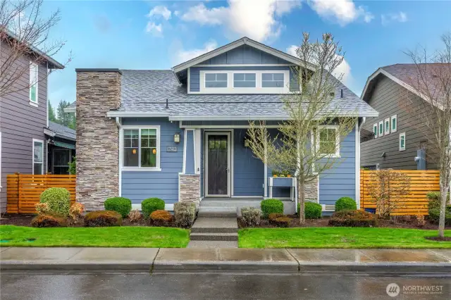 Charming street appeal with stone detail and a welcoming front porch overlooking the stunning and expansive views of Yonder Lake, permanent greenspace and the Seven Summits Lodge!
