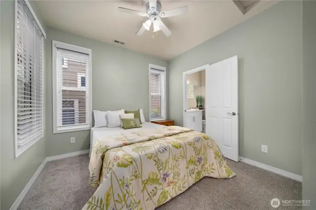 Guest suite with custom blinds and blackout shades.