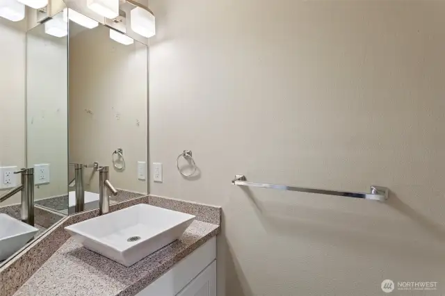 Powder room conveniently located near front door