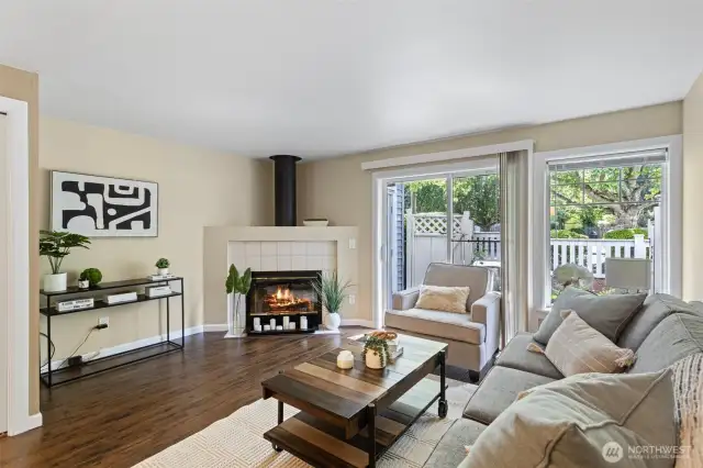 Cozy living space with wood fireplace and patio
