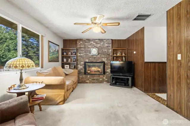 Spacious living room with gas fireplace.