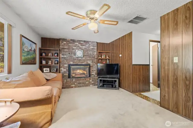 Hallway to the right leads to 3/4 bath, utility room, and 2-car garage.