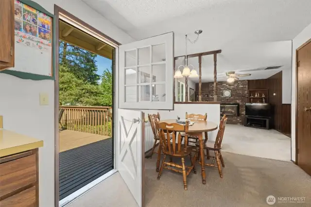 Charming Dutch door takes you to a large back deck.