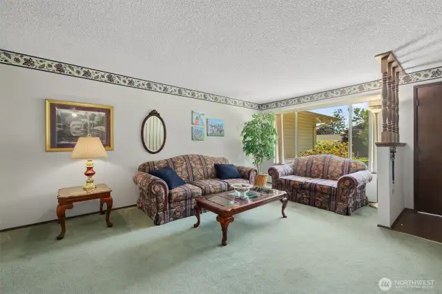 Front room with plenty of space and a large window.