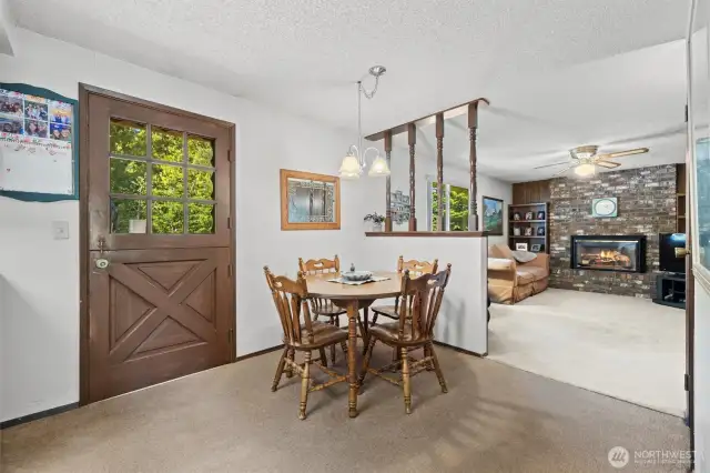 Dining area off the kitchen with backyard access.
