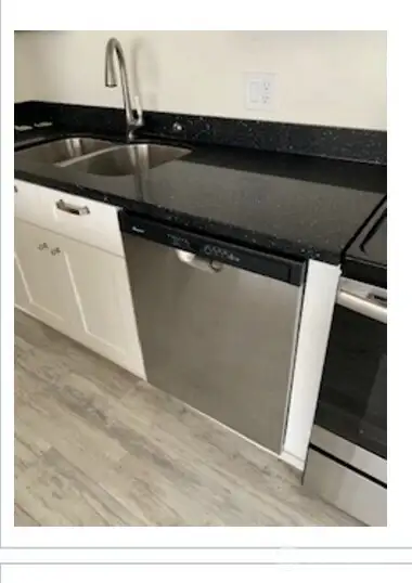 Unit 2 Stainless appliances make for a charming kitchen space