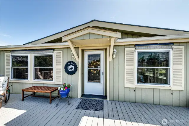 Welcoming entry. Shades and shutters for the windows.