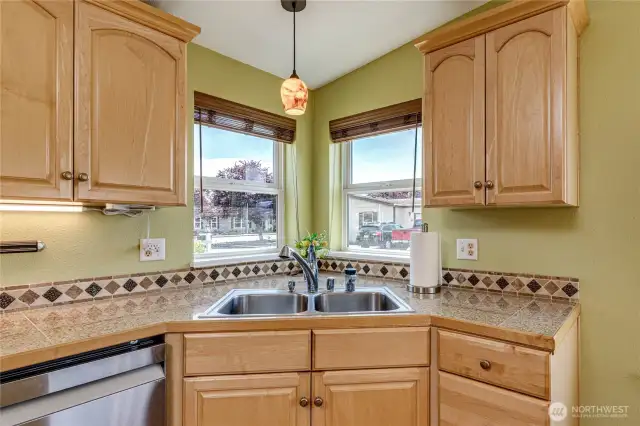 Sunny windows at corner sink.
