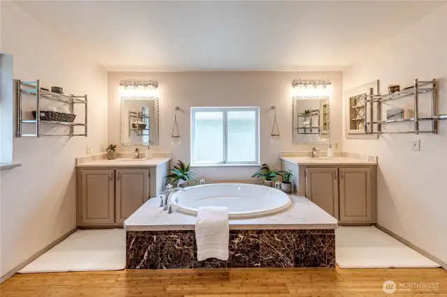 Dual vanities and large soaking tub.