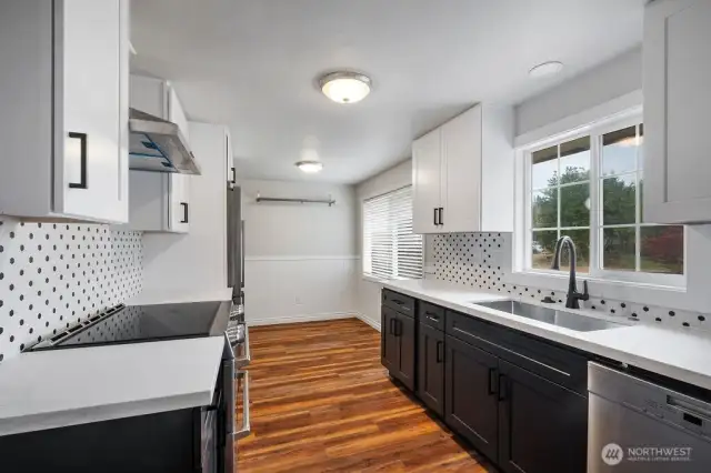 New cabinets and countertops in kitchen.