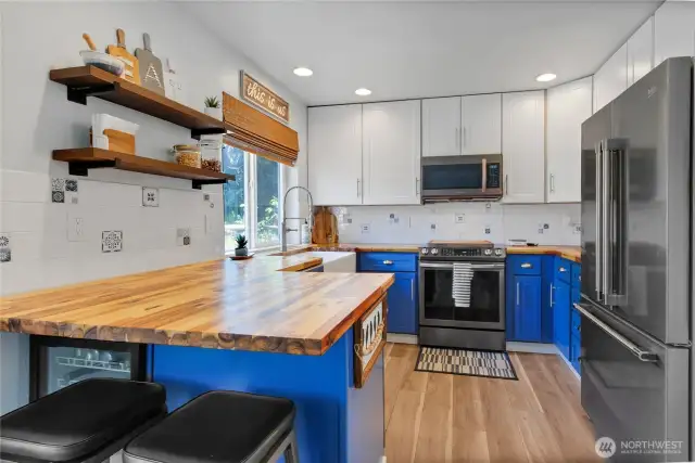 Contemporary floating shelves and backsplash in kitchen
