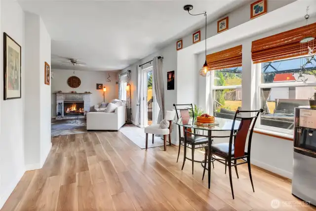 Looking into family room from kitchen area.  Great view of cozy fireplace.