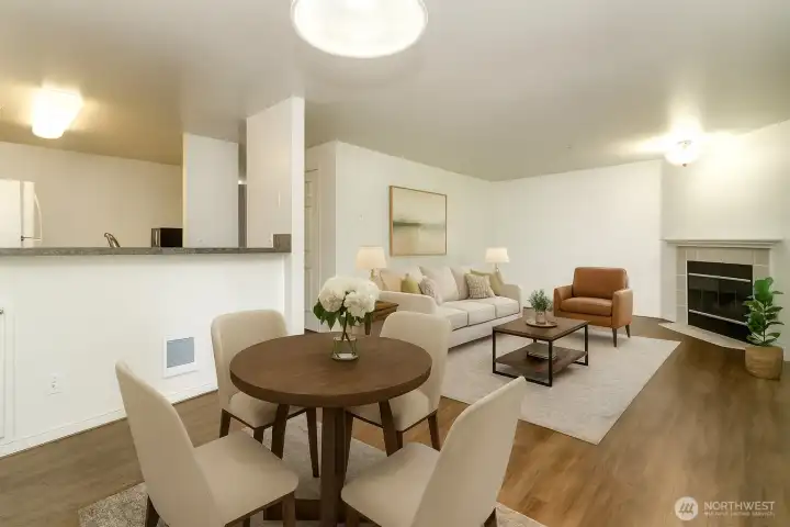 Open concept dining and living room; virtually staged