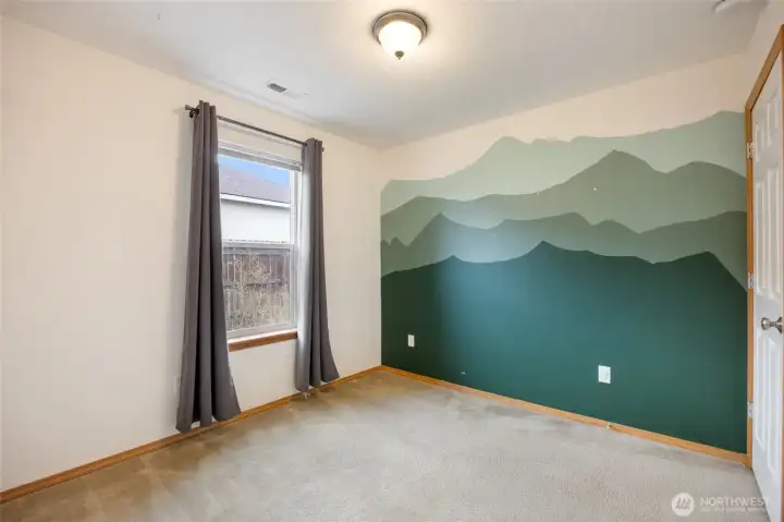 3rd bedroom with eye-catching custom mural- full of charm and character.
