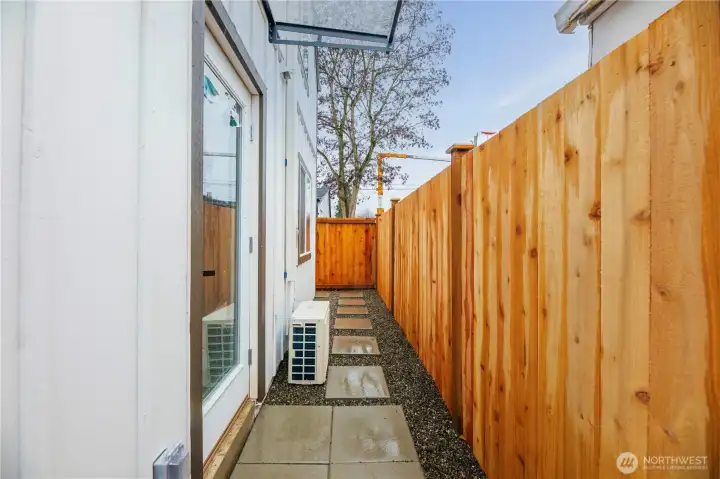 Door off the dining room with a walk way around the home.