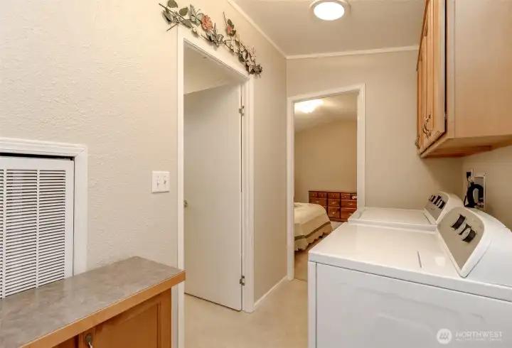 Spacious laundry area off the primary bedroom.