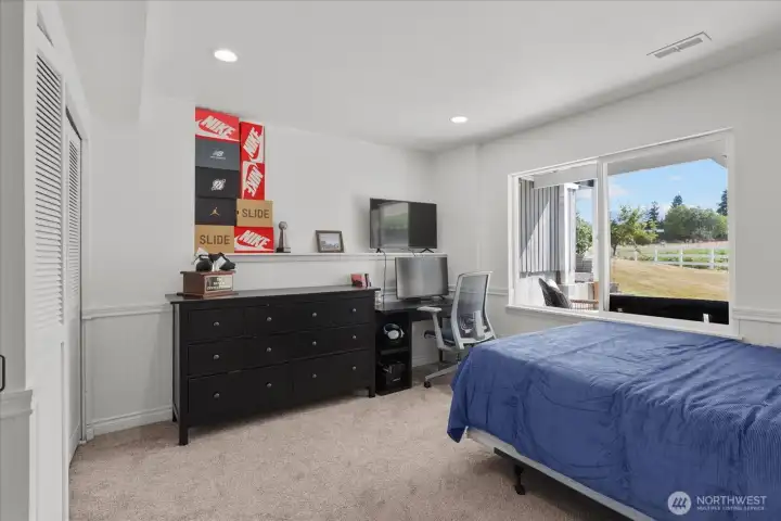 One of three spacious lower-level bedrooms.