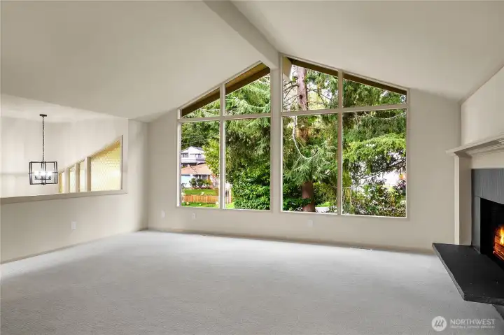 Vaulted ceilings, oversized windows, new carpet, wood burning fireplace