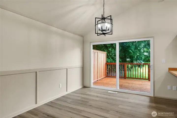 Eating area off kitchen with new LVP and back deck access