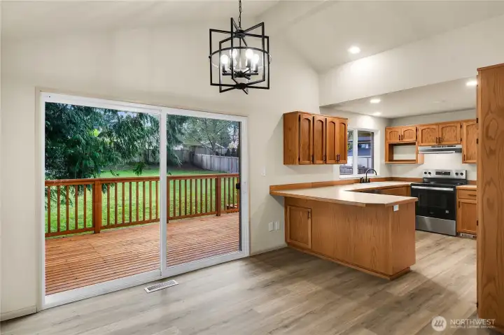 Eating area off kitchen with new LVP and back deck access