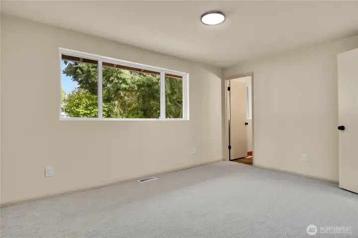 Primary bedroom on upper level with full en-suite bathroom