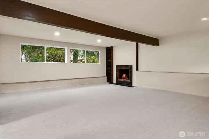 Downstairs rec room wit wood burning fireplace