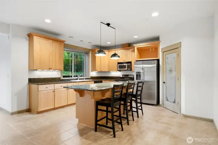 Lower level full kitchen including center island, pantry & all appliances. Also open to the family room!