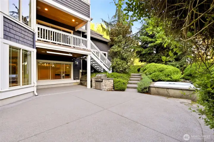 Another outdoor entertaining space including a covered space with 2 overhead outdoor heaters, built-in BBQ, patio space and relaxing hot tub.