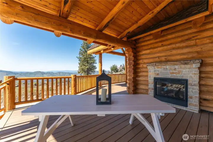 Exterior view of porch with double sided fireplace.