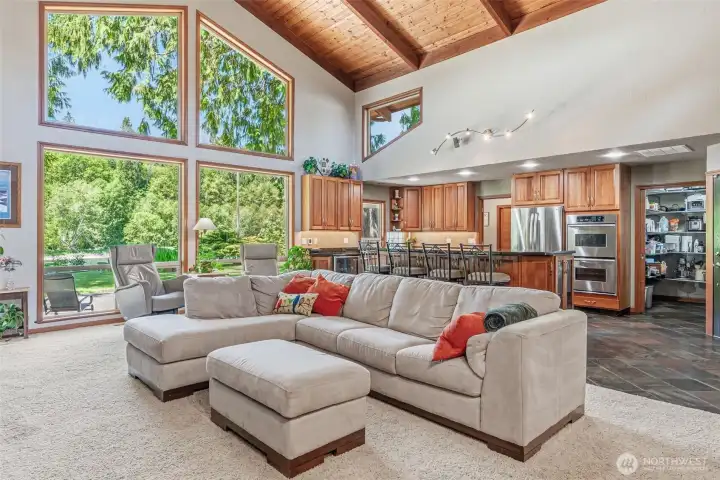 Open Concept Living with Wall of Windows facing the River Open Concept Living with Wall of Windows facing the River