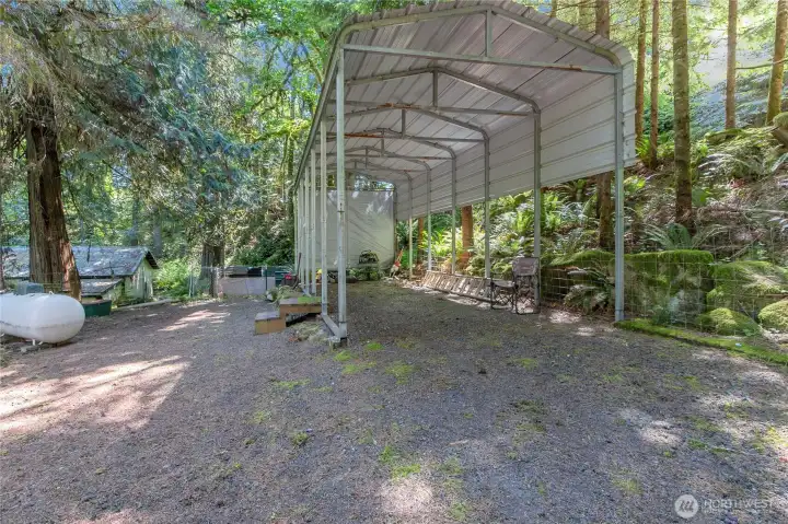 Propane tank, huge covered RV carport. There is so much room to do whatever you want!