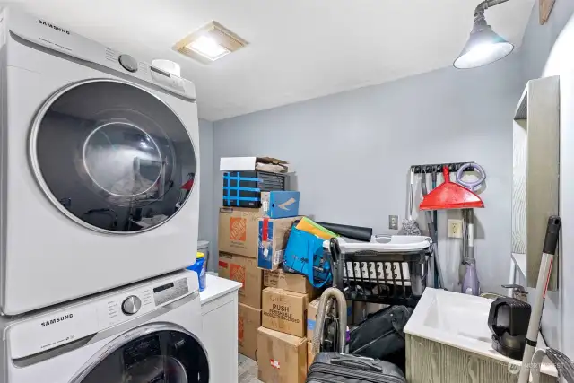 Excuse us as we are moving! The laundry room, behind the barn door, has a half bath too.