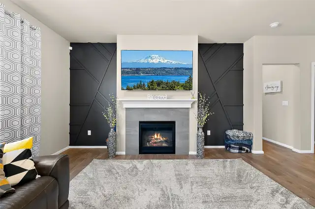 An elevated living space with stunning design features that flank the gas fireplace and media area, creating a focal point of modern elegance. These cool design elements not only enhance the visual appeal but also provide a chic backdrop for relaxation and entertainment.