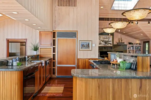 The kitchen is well equipped and has gorgeous slab granite counters with Fortuny light fixtures from Italy.