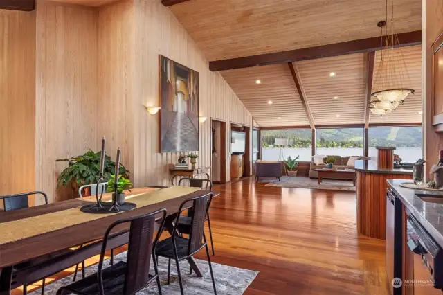 From the informal dining area you look across the bullet wood floors from Guyana with the clear ponderosa pine walls and ceilings.