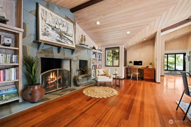 This fireplace is a pinnacle part of the home and such a grand feature. There are built-in bookcases on either side and the perfect desk alcove.