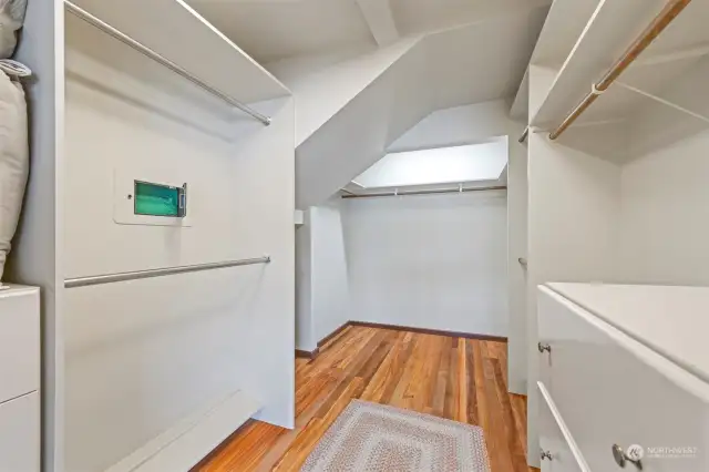 The walk-in closet for the primary bedroom is incredibly spacious with built-ins and has a wall safe.