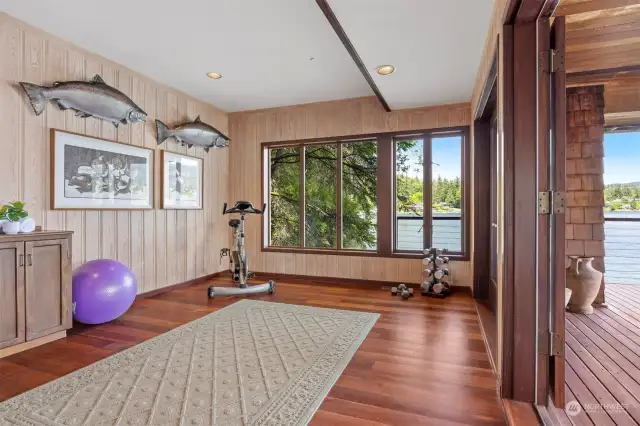 There is another room on the lower level that could be a 4th bedroom or office, but is currently used as an exercise room. This room also opens to the wraparound deck with French doors.