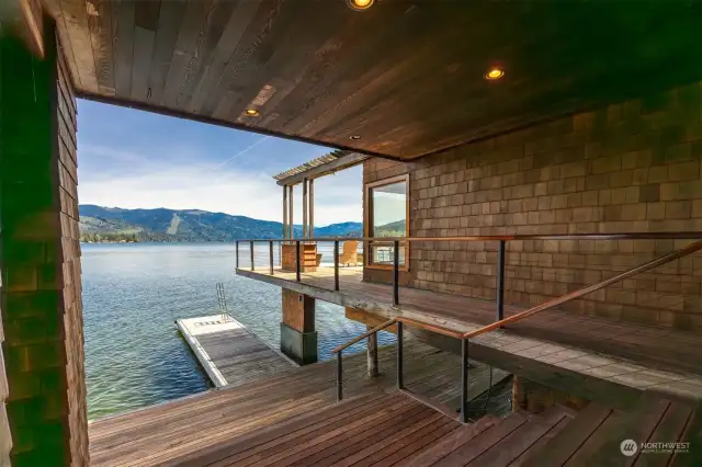 From the covered deck area one the lake level you can see the boat dock and there is abundant storage below the home, as well.