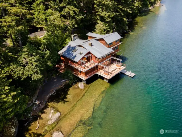 An aerial view of this exquisite home and beach on Lake Whatcom. This roof looks like slate but it is a rubber-based product and is just 8 years old. It is like slate, but better.