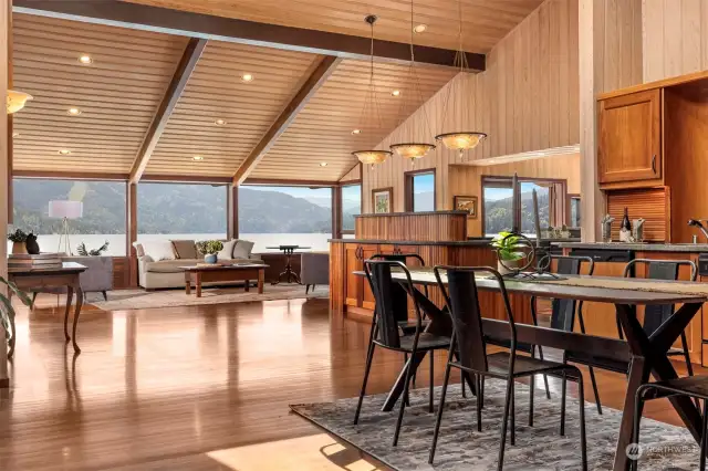 Looking from the informal dining area toward the living room with the kitchen in between.