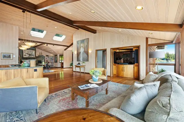 Looking across the living room toward the informal dining area with the sitting room and office niche beyond.