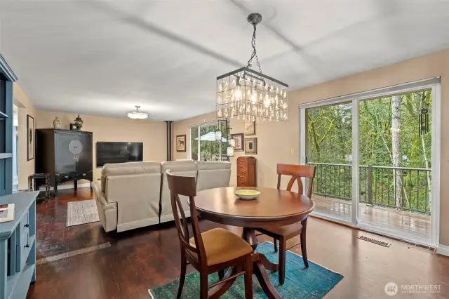 A dining room can be used for formal or informal dining, and has lovely views to the trees and foilage in the back yard.  A sliding glass door allows for easy use of the beautiful trex deck with aluminum railing.