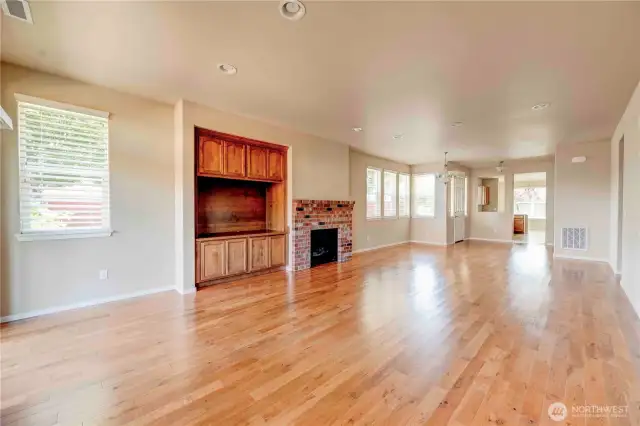 Custom built-ins and beautiful brick fireplace.