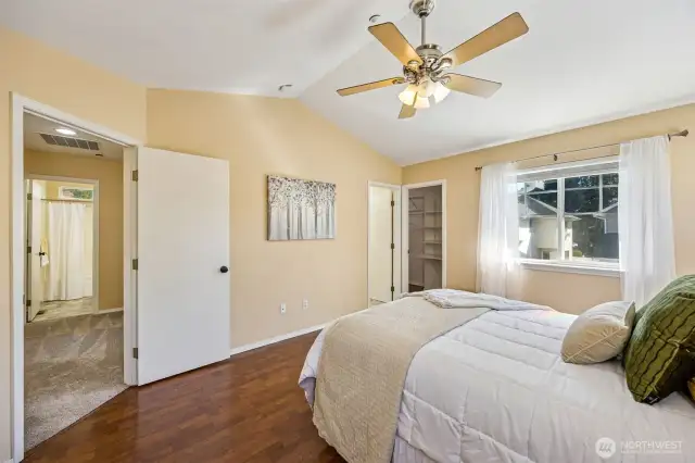 Primary bedroom with lots of natural lighting, overhead fan on remote.